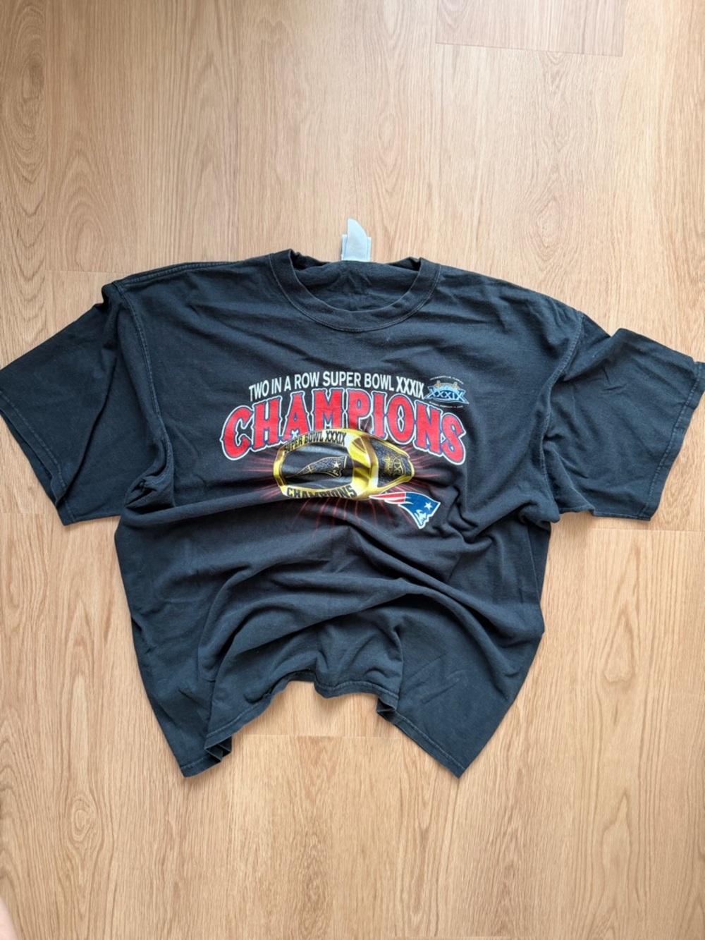 Lee Black Tee with Red and Gold Championship Graphic